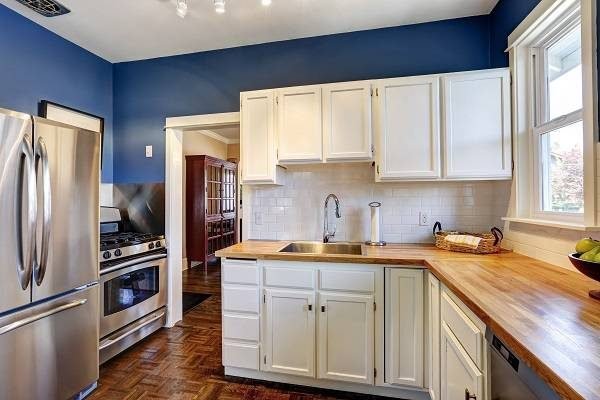 Cabinet-Painting-Newton-Massachuetts-White-Cabinets-Blue-Walls-ProTEK-Painters-600x400-1